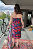 I ordered a bunch of dresses for this upcoming wedding and this is the one I am going with! It fits TTS. The ruching is real flattering. The neckline has a more double point than the photo looks and I find it extra flattering. - Brittany R.