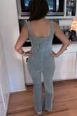 Love this jumpsuit. I wish there was a similar one with sleeves too. Comfortable and flattering, which is a hard combo to find in denim. Perfect length and I'm 5'5. I am a small on the top and a medium on the bottom, and the small fits well. Fitted but not too tightly, so if you are in between sizes, I'd size down. Highly recommend! - Marline K.