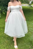 This dress was absolutely perfect. It fit so well and I got so many compliments on it! I styled it with a pearl necklace and a bow to wear it at my shower. Seriously in love with this dress! - Gabby V.