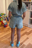 Really sturdy, heavier denim that will definitely not show panty lines or cellulite, but it will likely be heavier/bulkier than you'd like for summer. Probably only wearable in spring or early fall because of how heavy it is. Overall I thought it was really cute but it just wasn't my style. Also, I have a short torso and the top was longer than the bottom so it appears it is cut for a taller person. Definitely give it a try especially if you're on the taller side. Denim never goes out of style! - Marline K.