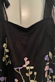 I was very hopeful to receive this item. The top portion of the dress seems to be made from scraps. There was almost zero detail on the top portion of the dress. Which made it look unfinished. The upper half looks armors plain black. Very disappointed. - Kristen B.