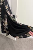 So happy with this dress! The satin material hangs beautifully, the top has the floral print on both sides in case it shows and the bottom half has a soft black liner. It's made in long vertical panels so the print doesn't align but I don't mind it at all. It's also quite flattering in the tummy area as the waist is high and again the way the material flows/hangs adds to that. Putting it with the lulus white bow heels. Love love it! - Alicia A.