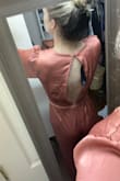 This is my first time buying jumpsuits. It looks very nice, but I'm not sure I'm sold on the jumpsuit style (my own personal preference, not the jumpsuit's fault). I ordered some belts to see if I like the look better if it's broken up a little more. I love the open back of this one. The V plunge is a lot deeper than I thought it would be and definitely deeper than it shows on the model in the photo. I have also ordered some cheap satin-like camis to see if I can makeshift something to cover the plunge a little better without messing up the open back (maybe cut out the back of a cami? Not sure yet). Maybe the deep V is a size issue and I should have ordered bigger? I bought this and another jumpsuit to potentially wear to a wedding and haven't decided which to wear yet. - Hannah A.
