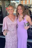 I wore 6 inch heels, and it was still touching the floor but is really beautiful. Wrinkles came out easy with a steamer. I wore nippies/cups with it. Very happy with it! - Susan L.