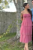 I wore this to a graduation and backyard wedding and it was perfect. It's not a tight fit except for the top part but it is loose and flows well. It's not heavy material and the color isn't as bold as I was expecting but not bad. I got so many compliments and it will definitely be a staple piece for spring. - Kellsie G.