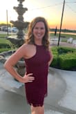 Wore this for an outdoor wedding and loved it! It's solid material so I had no concerns about it being see-through, blowing out of place, or being flimsy. My husband had to help me zip it because it was a little tight around the waist, but once past that, it was fine and fit like a glove. It was actually very comfy once on, and I felt great all night, through dinner and dancing. Loved the length, though it's a bit short when sitting. As long as you're aware, though, it isn't a problem. I'd normally pick a medium, but I sized up to a large, which was a must. This fit like a glove, but I'd never have made it into a medium. Love it and can't wait to wear it again! - Devon F.