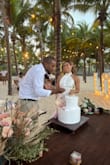 This was my reception dress for my Beach Wedding in Mexico. The high neck was so elegant and the low back and button details were sexy and classy at the same time. The material was pretty It was so easy to dance in. The only thing is the train is a little long so it got dirty in the sand but that's only because I wore no shoes. If you're thinking about getting this dress just DO IT. - Jenna A.