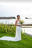Came out perfectly for a petite bride, just long. I had to take it to the seamstress and it came out perfectly. Like a glove. We added a rhinestone belt from an online store. - Wanda M.