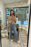 This top is so versatile and perfect for spring and summer. While the majority of the top is stretchy, the bottom part closest to the waist is NOT stretchy or flexible. - Marie D.