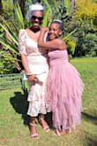 The dress first of all fit me like a glove. I looked so elegant and stunning. The quality of the dress was perfect, and I was so confident and comfortable in the dress. By the way, I caught the bouquet; my wedding should be next. - Merrilyn K.