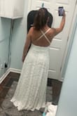 I tried on several different styles. Being short-waisted, it was really hard to find something that looked right on me. This dress is perfect; it fits (other than needing to be a little shortened), is fancy enough without being overboard, and is the perfect shade of off-white. The only thing is the straps are in a weird spot (as other reviewers have mentioned), but it doesn't bother me enough to have them moved. Lulus should maybe update the model picture so it's more accurate though. Can't wait to wear it for my wedding next month! - Heidi C.
