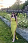This dress fit perfectly. The strap stayed in a position that was comfortable. The zipper is on the side which I liked. I wore shorter heels, so I could have gotten it hemmed, but overall it was great. - Haley C.