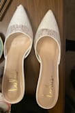 Great shoe, cute little thing, runs small for people with wider feet. I noticed on the back of both heels were black scuff marks, and there's a little scuff on the toe, not sure why? Maybe they were used and returned? - Jessica D.