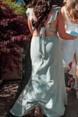 This dress is so cute! Received so many compliments at a wedding I was in in May! Fits true to size but I did have to tie the back pretty tightly so it wouldn't move because I have a shorter torso, and it stayed put all night! Highly recommend! - Allison S.