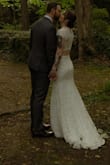 This dress surprised me! The fabric is actually quite comfortable and stretchy, and fit my body so well. I only had to get an inch or 2 hemmed as I was wearing sneakers for my elopement. If I was wearing heels, I may not have even needed to hem it! The only downside is that it's pretty difficult to get out of - there is only a side zipper on the top to the armpit, so it's hard to wiggle your arms out and get it off. Despite that, it was perfect for my private elopement! - Elise C.