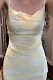 I am in love with this dress! It fits so perfectly and accents curves. I originally bought to wear to a wedding because it is a pale yellow but in natural sunlight looks a little more white with yellow so decided not to, but I loved it so much I kept for a different event (: - Sami T.