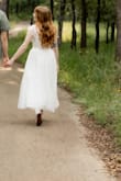 Other reviews reported that the arm straps are a bit too tight, I did not personally have said issue. The dress fit pretty true to size otherwise. - Jess M.