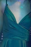 I love this dress with my whole heart! The color was beautiful and the fit was amazing. However, I bought this dress for a school dance, and halfway through the night the strap of the dress snapped. I recommend buying this dress for a calmer event rather than one where you'd be moving around a lot and dancing. As you can see in the picture, I needed to clip the strap on with a binder clip. - Taylor S.