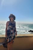 I was trying to find a dress for a coastal wedding. It fits really well. I received multiple compliments throughout the night. It does enhance the chest area, so if you're bustier like I am, it can be a little uncomfortable if you don't want to show too much. It is lined inside, but the lining rode up a little. I wore some boyshorts underneath, and it stayed down, which was more comfortable at the reception for dancing. Also best if it's windy as the dress flew up a couple times!  Otherwise, it is a beautiful dress and quite flattering for an hourglass figure. - Linette M.