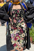 Got lots of compliments at graduation. Went really well with my all black cap and gown. Might need it steamed ahead of time tho, the flowers stick up quite a bit. - Hannah R.