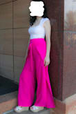 I love these pants! They are so fun and flattering! They are a little long on me so I would recommend wearing taller heels if you are shorter like me :) I also don't really have very big hips. It was a little difficult for me to put them on, and the slits in the sides are a little high so be careful when sitting or if it is windy out. The fabric is very smooth and comfortable. The pants are also not see-through, although they will show lines a little at certain angles. I would definitely recommend these pants and have gotten so many compliments on them! - Maria K.