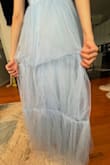 The dress was beautiful and fit great, however, the tulle in the back was sewed incorrectly. It should've been sewn on the inside, but it was sewn out, so it looked weird. It also seemed sewn in weird places, so the tulle couldn't sit properly. I wish it was sewn correctly because I liked it and wanted to keep it. - Heather C.