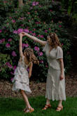 I ordered this dress for a family photo shoot and overall loved the dress. It has pretty lines and photographs beautifully. I ordered a small. The fit was good with the exception of the top fitting on the loose side. By no means do I have "Large" breasts, but I'm also breastfeeding so they're not small either. The plus side of that was being able to BF in the dress! The slit was a bit high, but I didn't mind. - Wilnelia N.