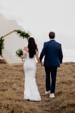 This dress is beautiful and fits like a glove, but there is no stretch. Didn't need to alter anything but the length, which was a given because I am 5' tall. My husband and I eloped, and it was the perfect dress for that. However, if this was an actual wedding with dancing, I would not recommend. You cannot lift your arms at all with the sleeves; you are extremely constricted. I gave it 4 stars only for this reason. - Samantha P.