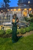 The dress was very pretty. The only thing wrong with it is that the back ran a little big; I had to stitch it up. It also runs low around the boob area so you have to be careful. - Shenique S.