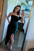 I sized up to a medium, usually wear a small. The small fit like a glove, but the medium was more comfortable for me with the high thigh slit. Love this dress! - Heather L.