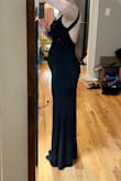 I love this dress so much! Very beautiful material, stretchy and slinky, not too thick so it's comfortable in the summer. The low back is extremely flattering, and the neckline is a nice elegant cowl neck without too much material - it doesn't bunch awkwardly. The straps are a bit long for me (they fall off sometimes) but should be easy to alter or secure with fashion tape. The dress hugs your belly and butt/thighs so if you have some lower belly fat like me, I would recommend adding shapewear (but don't get high-waisted shapewear because it'll show in the back). I recommend sizing down in this one - I had to exchange for a Small, the top in the Medium was way too loose.  The length is good, I don't need to hem it if I wear heels. Photos are of the Small with 2.5" heels, no shapewear. - Polina V.
