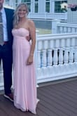 I was searching for something different than my go-to black dress for a friend's formal spring wedding. This dress is simply beautiful! The pastel pink was perfect. The chiffon material created a light and airy feel. The dress had a beautifully designed sweetheart cut top, and the slit added a touch of sexy. I'm 5'7" and like my formal dresses long, so I was able to wear 3.5" heels! I have wide hips, but a small fit perfectly! The back had a tiny train to add a nice touch for the formal event. It was different in the perfect way, and could be used as a bridesmaid dress too! - Melissa B.