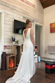 Everyone freaked out when they saw this and insisted I get married in it. I thought it was way too loose at the top. I tried it on for a July Texas wedding, and would definitely cook in it. It's a beautiful dress, and made me feel like a goddess, but I didn't like how it was at the bust. Maybe if I had the straps shortened it would have worked. I thought it was very flattering overall. Just not for me. - Tiffany E.