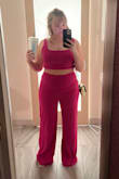 I wore this in 110 degree Vegas weather and never felt sticky or constricted! The fit is looser in the pants and very long. However; that just might be because I sized up a bit (I'm right in between a L and XL). For larger chested girls, I would size up in the top so you can comfortably wear a bra underneath as it's short. - McKayla A.