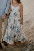 I bought this dress for my engagement shoot and was so happy with it! As someone who is pretty short it is hard to find longer dresses, but this was perfect from the fabric to the fit, etc. Very true to photos. Love that it was adjustable in the straps and back as it was slightly bigger in that area. 100% recommend! - Cassie H.