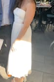 I wore this for my rehearsal dinner and loved it! The top may be a bit loose depending on your chest size. I wouldn't size down though unless strapless tops are normally loose on you. I thought it was really cute and was surprised the pleats held up after being washed! - Kaitlin E.