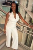 Purchased in white.
This jumpsuit was absolutely amazing and I felt sexy in it!  I was worried about my boobs because I'm slim but Busty. I was able to use boob tape to secure my breast because you cannot wear a bra with this jumpsuit - Kelly K.