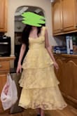 I ordered an xs at first and it turned out too small and I couldn't get it to zip up. Size Small fits better on me but still was a struggle to zip up. I'm on the paler side but the yellow didn't wash me out! The dress came in the mail very wrinkly and looked cheap at first but once you iron/steam it and give it a chance, the dress looks REALLY good! I got a lot of compliments. - Hannah D.