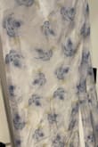 Looked beautiful when I removed it from the bag. Slipped on and noticed what looked like wine drop stains across the belly, and the fitting in the back was bunched up weird. I, then, noticed there were dye droplets all over the dress. When I removed it to inspect the back, it wasn't even sewn straight. Awful dress. - Kristy C.