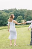 Wore this dress for an engagement photo shoot. Fits true to size. Tying the straps to match each other took a bit of finessing but I love how the bows looked. You can get very creative with how they're tied - Julia C.