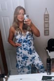I loved this dress for a hot summer wedding. The cotton material is nice. The hemline is beautiful as well as the ruffles on the bust. I love the blue floral print. The white looked great against tan skin. The fit was a little loose, probably could have sized down but the loose fit still looked nice. - Shannon S.