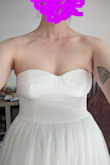 Very pretty dress, but it didn't work on my body. I have a long torso, and the bodice of this dress felt too short. It also didn't do much for my chest and bust (made my chest look bigger and my boobs look smaller). There wasn't any structure in the cups, and the stickiness at the top of the dress didn't feel like enough to prevent the dress from falling down and making me flash everyone. - Rebecca P.