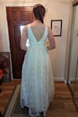 OK, despite this being "the one," I was not immediately blown away when I put it on. But it's grown on me, and it's going to be perfect for our mountain elopement (and reception a couple of days later)! The tulle is very poofy, but I think it dresses up the dress a bit; I initially worried that the dress looked too casual, but the full skirt helps elevate it. The waist is pretty tight but not unbearable. I also ordered a L, and the waist was too roomy. The V-neck comes down past where a regular bra sits, so I'm going to have to get some sticky pads. However, it didn't look bad without any bra; I just want to look more supported. I haven't bought shoes yet, but I will definitely need some high high heels if I want to skip getting the dress hemmed. TBD... I can imagine wearing this dress again with some alterations: taking out a layer of tulle and hemming it above the knee. Just a thought! - Rebecca P.