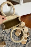 I got this bag to use for my rehearsal dinner and it's very cute! Great quality. The color is a bit paler than in the photo online, so it doesn't match my shoes exactly. But it's close enough! It's a little bigger than I expected, so it will easily hold everything I need (phone, keys, wallet, makeup, etc! No inner pockets but it will be perfect for my rehearsal dinner or going out to dinner on my honeymoon! - Mary M.