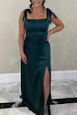 I wore this to a wedding and got so many compliments! I should've gotten it hemmed because it was a little long for me but I only tripped twice. The ties on the shoulders were so flattering but it was a little tight in the ribcage. Loved it! - Katlyn C.