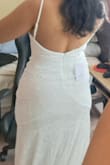 The material feels so soft and stretchy it's very flattering and comfortable. The tail is very long and it does get a little bit uncomfortable to walk on it (but that's just my preference, I will hem it). The back of the dress is very beautiful, if you don't have curves it might look a little bit odd on you so keep that in mind. - Ivanna P.