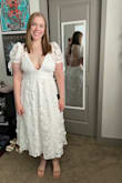 This dress was so beautiful for my bridal shower!! The waist was not too snug, and the top and back are adjustable with the ties. I wear a 12 in pants and typically a size large in shirts, for reference, so I think the dress is true to size. I chose to wear Boombas with it to give the girls some lift and to make sure there was no slippage, but it was difficult to get the lining to cooperate since it was not attached to the lace and lacked structure. Otherwise, I love love love the dress and look forward to wearing it again for my rehearsal dinner! - Rachel R.