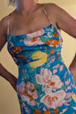 This dress is so cute. My only issue is the top doesn't want to lay nicely on my breasts. I even tried tape to hold in place. Just doesn't look right.
The photo includes the look with 2 sided tape. - Judy D.