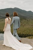This dress was everything I dreamed up for my mountaintop and lakefront elopement! I had the straps and button closure taken in slightly for a better fit and loosely attached the slip to the lace on the bottom so it wouldn't pop out and show too much, but other than that everything was perfect! It's very flattering, super comfy, and I received so many compliments from people! It was definitely worth the cost! It also held up well to hiking down a mountain and walking through a forest. I can't recommend this dress enough! - Julia B.