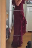 The dress is a bit too long, I needed to put heels to wear it. Also, one sleeve can be adjust however the other one cannot, it's a shame...
Besides those problems, the dress is absolutely lovely ! - Clarisse D.